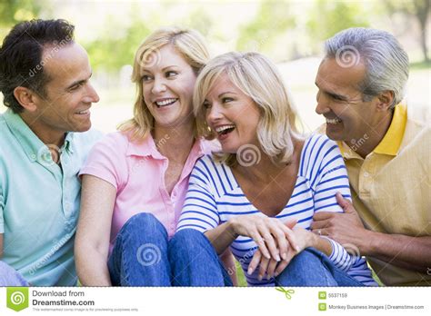 Two Couples Outdoors Smiling Stock Image Image Of People Adult 5537159