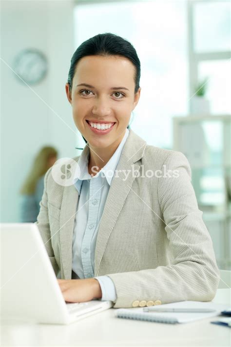 Portrait Of Pretty Secretary Looking At Camera While Working Royalty