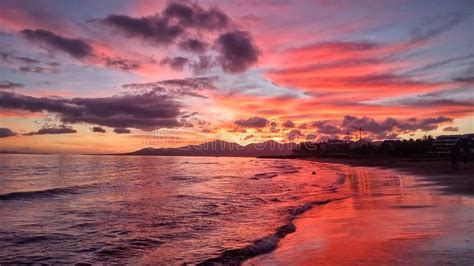 Beautiful Bright Red Sunset Over The Atlantic Ocean In Puerto Del