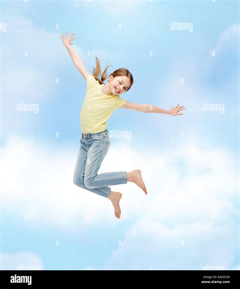 Smiling Little Girl Jumping Stock Photo Alamy
