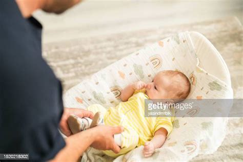 Put Baby In Crib Photos And Premium High Res Pictures Getty Images