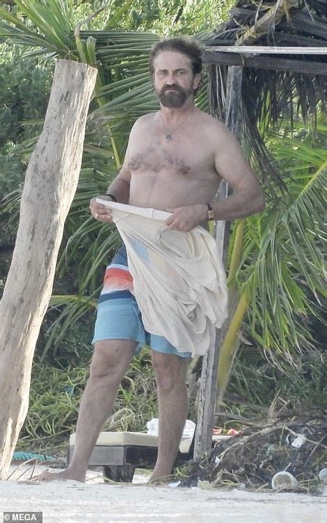 Shirtless Gerard Butler Enjoys A Chat And A Dip In The Ocean With