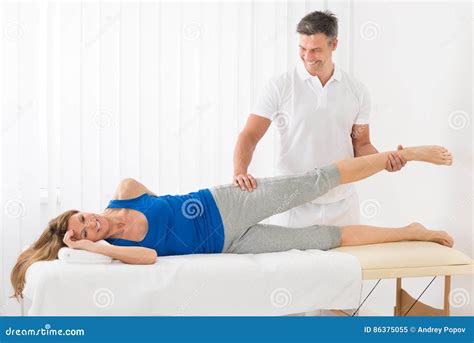 Male Therapist Giving Leg Massage To Woman Stock Image Image Of Physiotherapist Medical 86375055