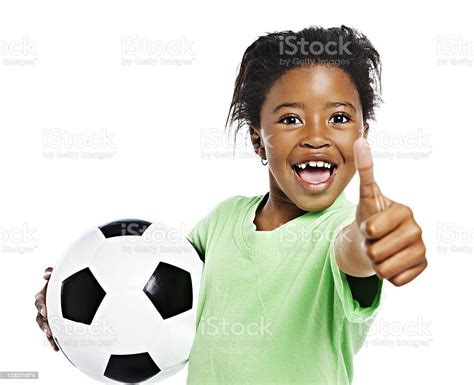 Little African Girl With Soccer Ball Gives Triumphant Thumbs Up Stock