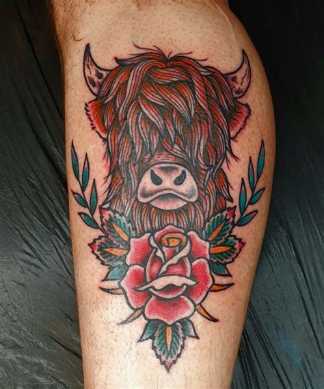 A Tattoo On The Leg Of A Man With A Bull Head And Roses