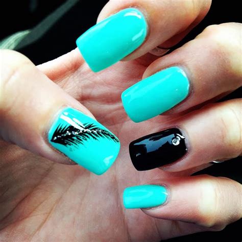 Turquoise Nails With Feather Nail Art And Black Accent Nail Teal Gel