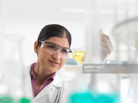 Female Chemical Scientist Developing Formula In Laboratory High Res