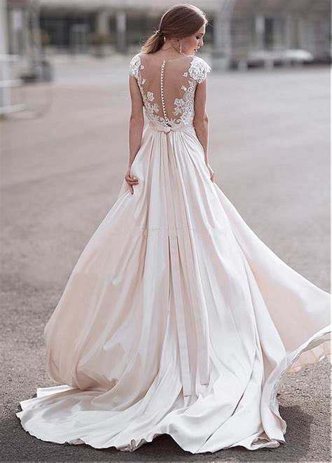 We may earn commission on some of the items you choose to buy. Elegant Light Champagne Wedding Dresses Sheer Neck Cap ...