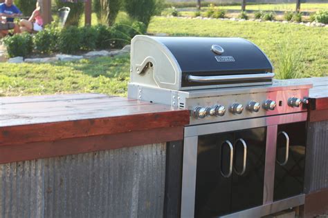 Easy outdoor kitchen diy with built in weber propane grill, gmg daniel boone, and concrete counters. Building An Inexpensive Rustic Outdoor Kitchen - Old World ...