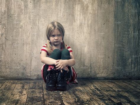 Sad Little Girl Sitting On The Floor High Quality People Images