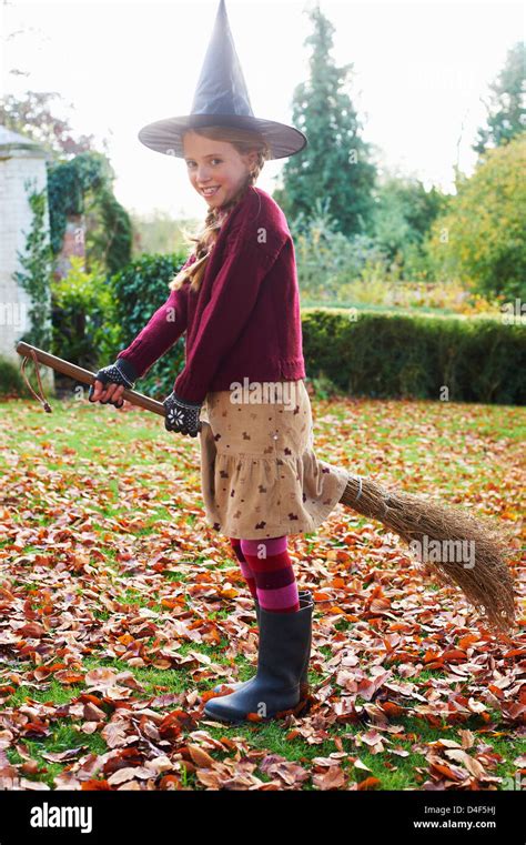Girl Wearing Witch Costume On Broom Outdoors Stock Photo Alamy