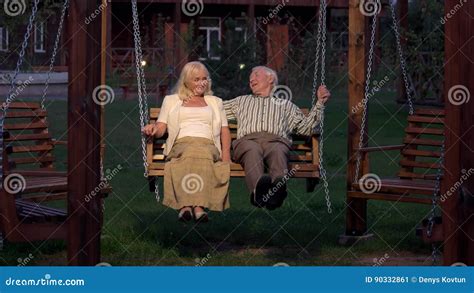 Couple Sitting On Porch Swing Stock Video Video Of Evening