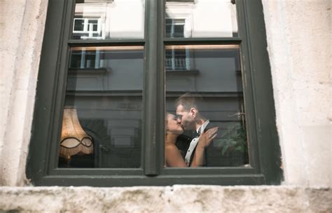 Free Photo Wedding Couple Kissing Behind Window
