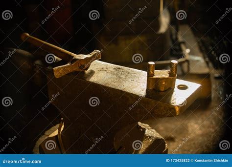 A Hammer On The Anvil In Natural Sun Lighting Indoors Stock Photo