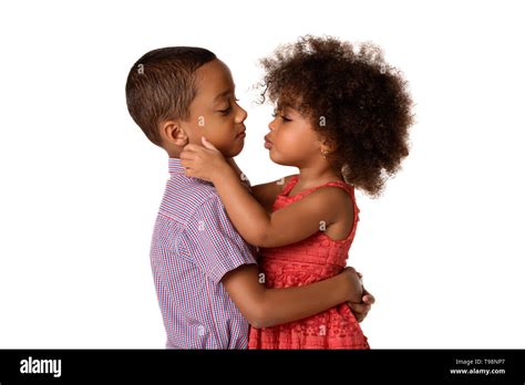 Two Cheerful African American Siblings Sister Kissing Her Brother