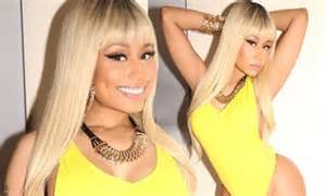 Nicki Minaj Sizzles In Yellow Swimsuit To Promote New Film Barbershop