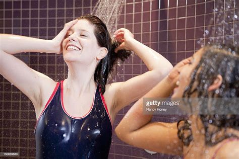 Smiling Women Showering In Pool Photo Getty Images