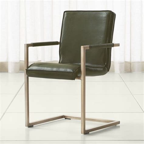 Chairs are composed of lime green vinyl button back and seat, with a wrought iron metal body. Hudson Green Leather Dining Chair | Crate and Barrel (With ...