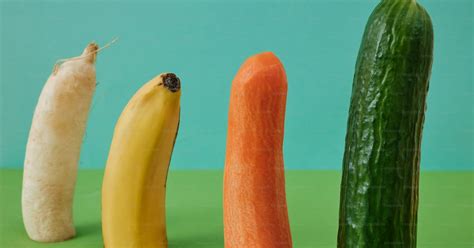 a cucumber banana and carrot are arranged in a row photo penis image on unsplash