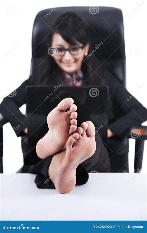 Asian Businesswoman With Feet Up On A Desk Stock Photography Image