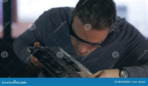 Repair Motherboard And Technician Working On Device In A Workshop