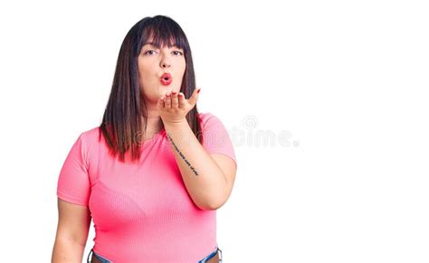 Young Plus Size Woman Wearing Casual Clothes Looking At The Camera