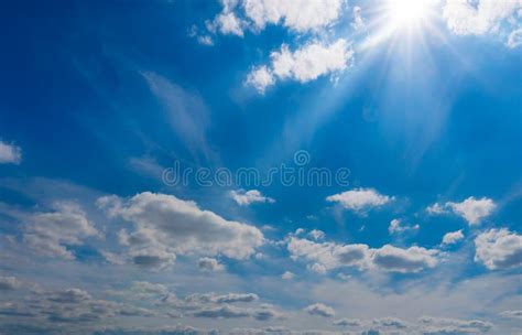 Blue Sky With Clouds And Sun Shines Stock Photo Image Of Blue Cloudy