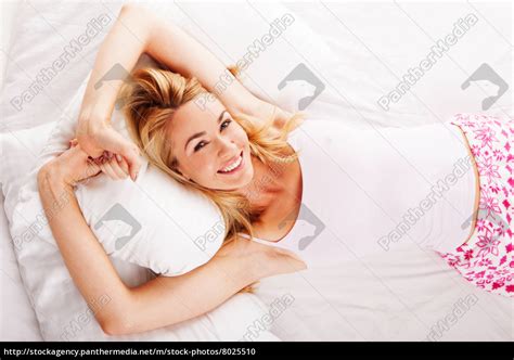 Smiling Woman Lying In Her Bed Stockfoto 8025510 Bildagentur