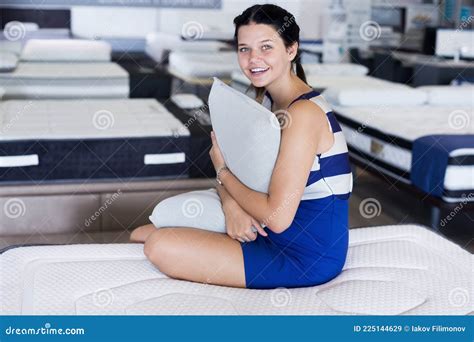 Girl Is Sitting With Pillow And Testing New Mattress Stock Image Image Of Choose Comfortable