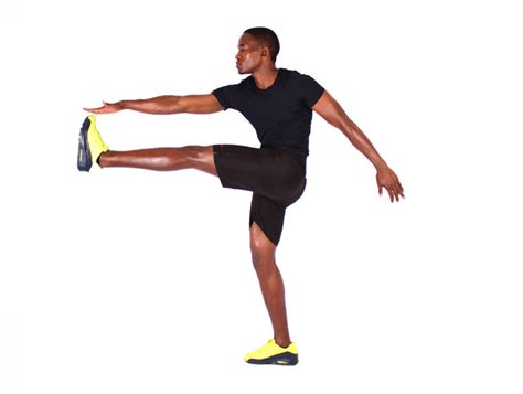Flexible Man Doing High Kicks Exercise