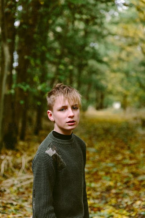 Teenage Boy In The Woods In Autumn By Stocksy Contributor Helen Rushbrook Stocksy