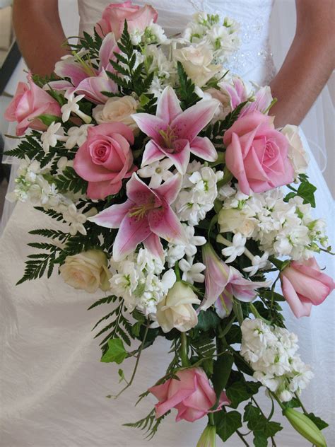 traditional cascading bouquet of pink stargazer lily pink sofie rose white stock stephanotis