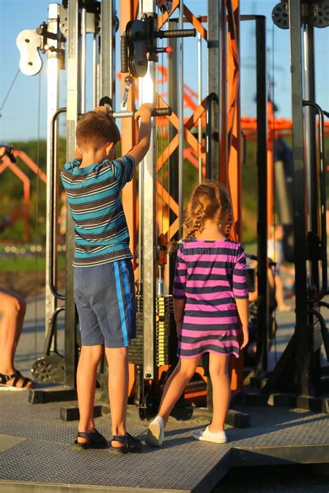 Back Portrait Of Caucasian Children Working Out On The Outdoor Sports