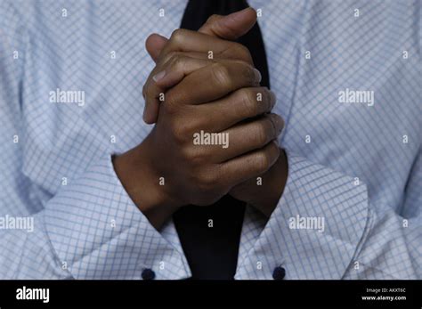 A Persons Folded Hands Stock Photo Alamy