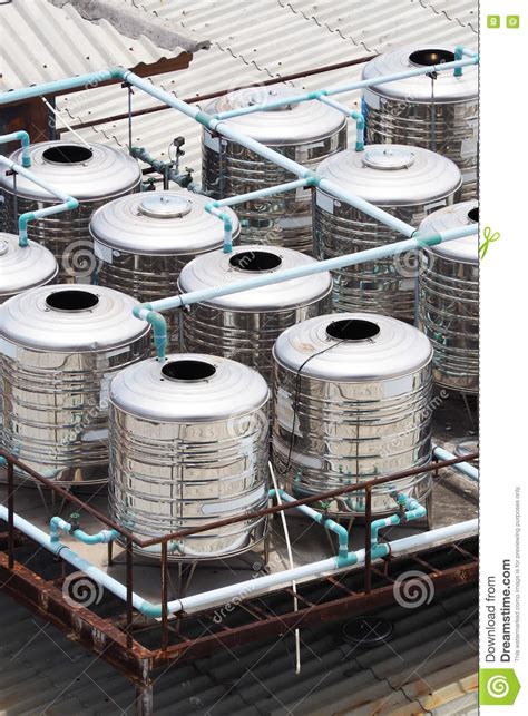 The sidewall and bottom are 20 gauge and the top is 22 gauge, all from domestic we use stainless steel rivets in the construction process making them more durable. Stainless Steel Water Tanks On Rooftop Stock Photo - Image ...