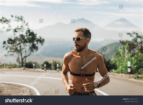 Man Running Topless Uphill On Asphalt Stock Photo Shutterstock