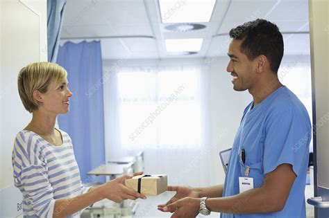Patient Giving Nurse T In Hospital Stock Image F0138977
