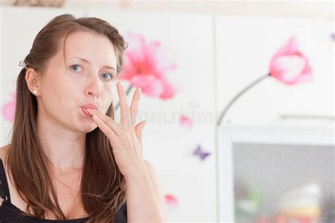 Attractive Girl Licks A Finger Picture Image 6262049