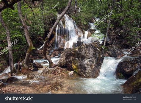 Beautiful Multi Layered Waterfall Between Vegetation Stock