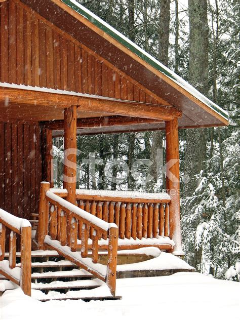 Snow Covered Log Cabin Porch In The Woods Stock Photos