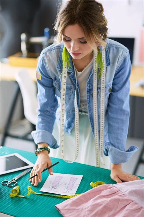 Fashion Designer Woman Working On Her Designs In The Studio Stock Image