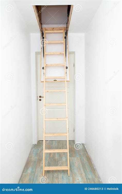 Wooden Foldable Pull Up Attic Stairs Ladder At Empty White Home