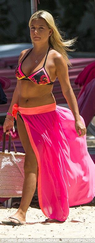 zara holland struggles to contain her assets in a skimpy floral bikini top in barbados daily