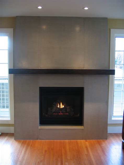 A fireplace or hearth is a structure made of brick, stone or metal designed to contain a fire. Concrete Fireplace