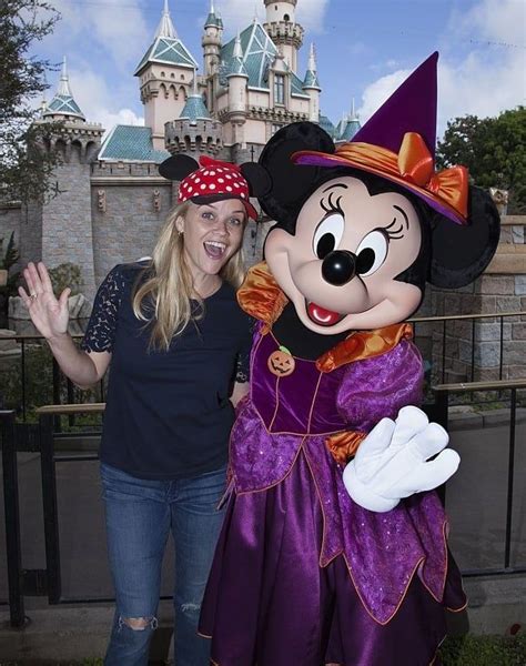 Reese Witherspoon Smiling With Minnie While Wearing Her Minnie Themed