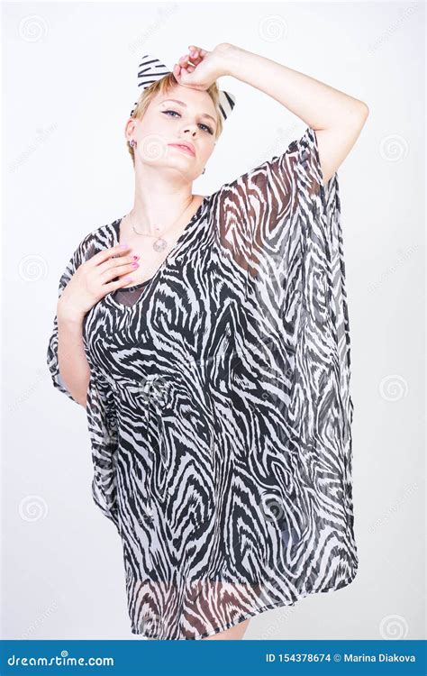 Attractive Pretty Woman Wearing Zebra Dress In Studio Stock Photo