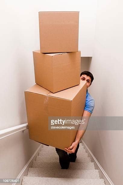 Carrying Boxes Up Stairs Photos And Premium High Res Pictures Getty