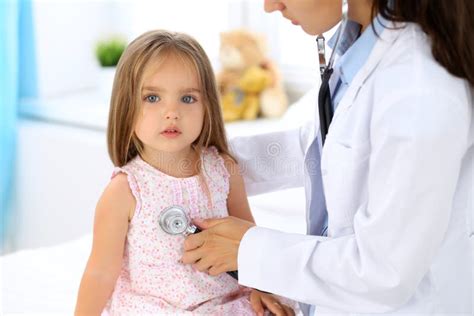Doctor Examining A Little Girl By Stethoscope Stock Image Image Of