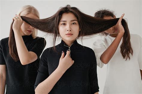 Multiethnic Models Posing With Hair Del Colaborador De Stocksy