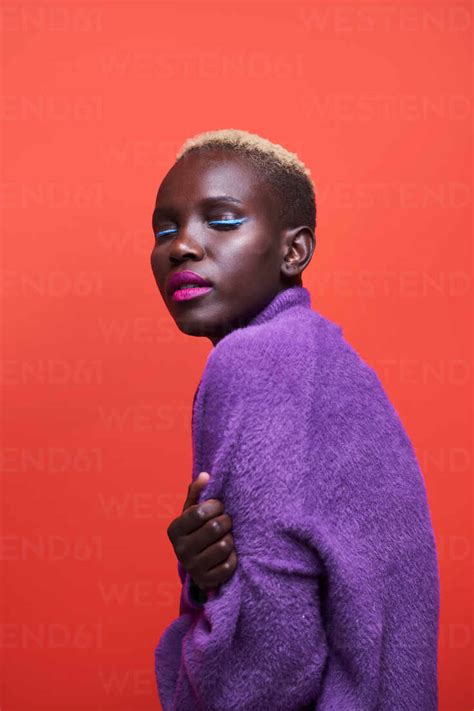 Charming African Female With Bright Makeup And Short Dyed Hair